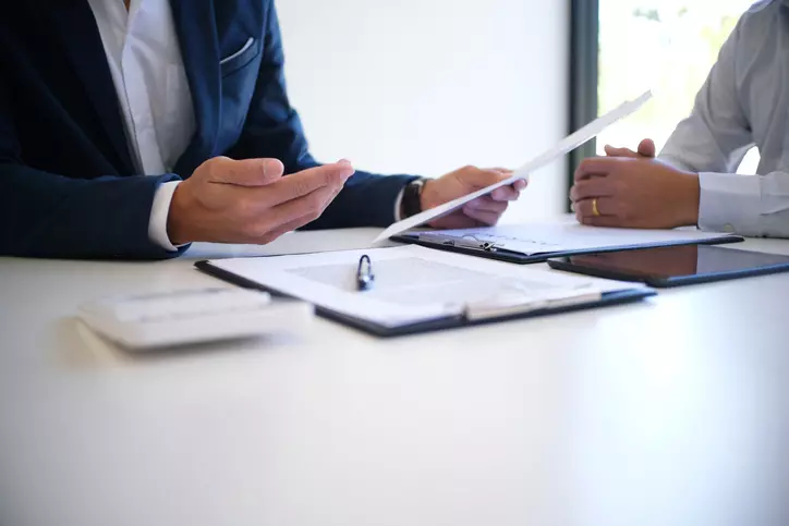 Debt collection attorney sitting with client