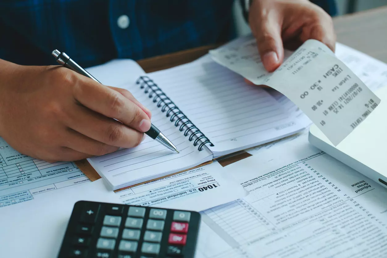 man calculating his debt